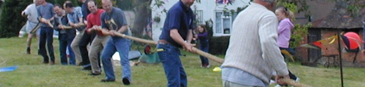 A group of people doing tug-of-war