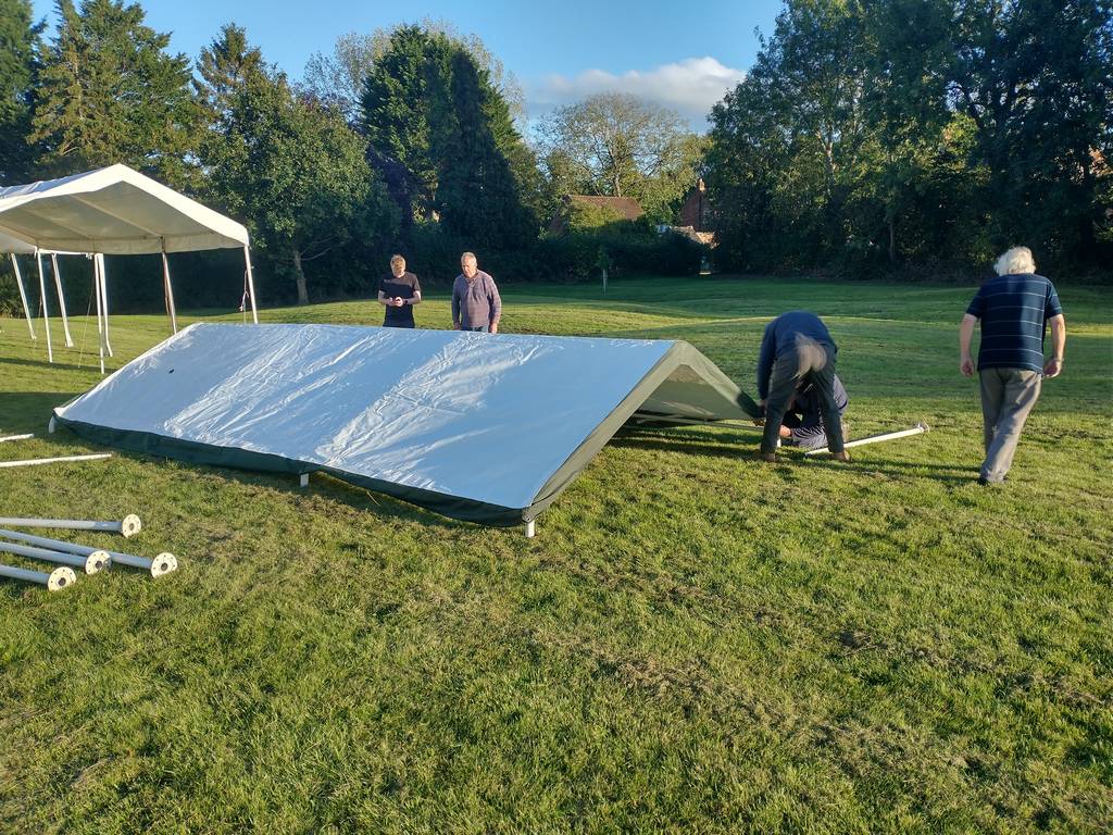 Team putting up marquee